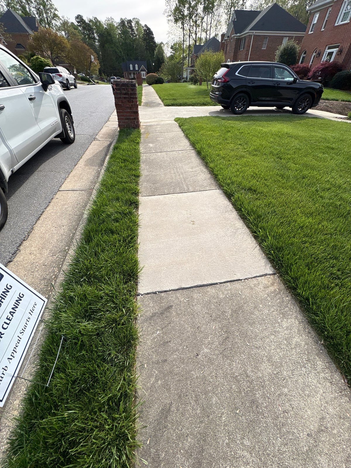 Driveway pressure washing and cleaning of concrete surfaces