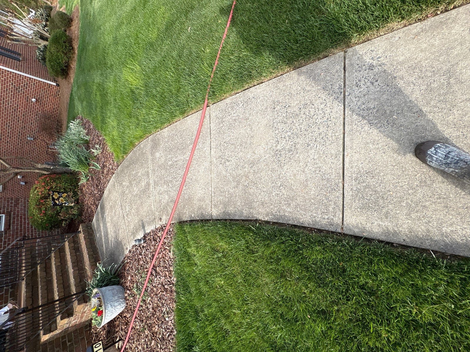 Driveway pressure washing and cleaning of concrete surfaces
