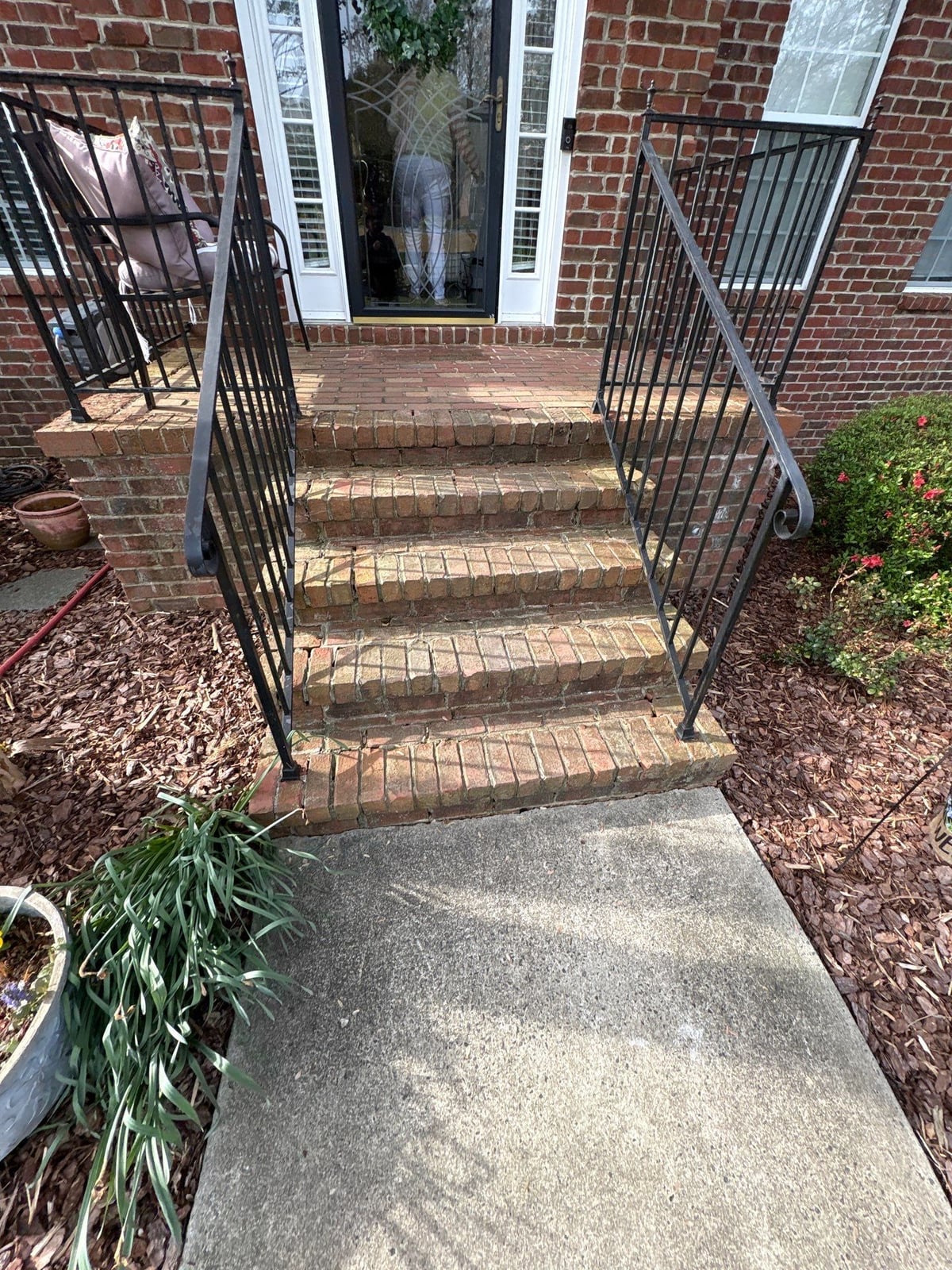 Driveway pressure washing and cleaning of concrete surfaces