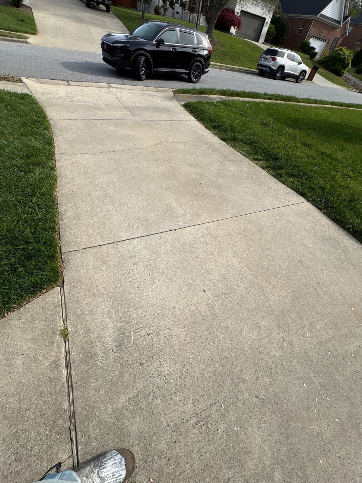 Driveway pressure washing and cleaning of concrete surfaces