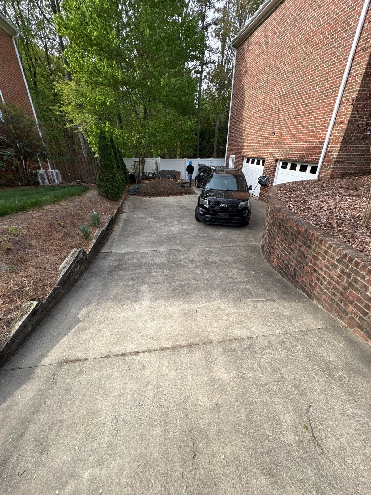 Driveway pressure washing and cleaning of concrete surfaces