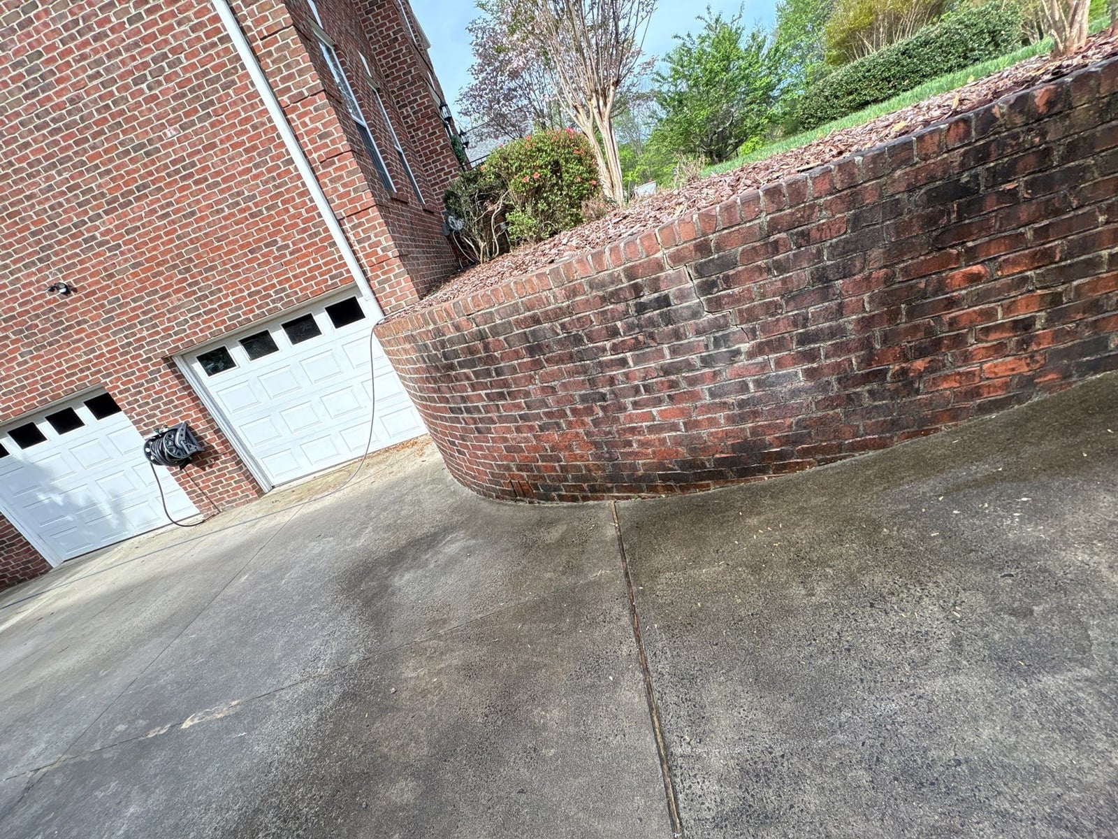 Driveway pressure washing and cleaning of concrete surfaces