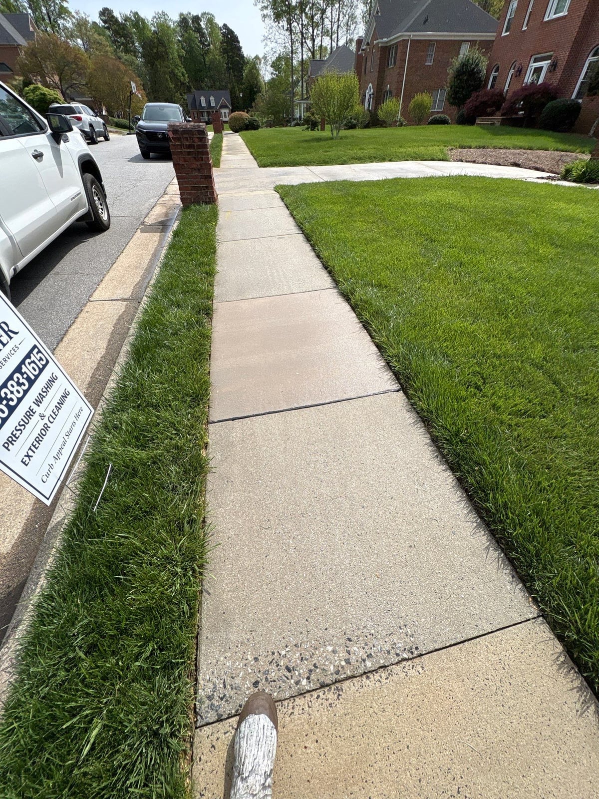 Driveway pressure washing and cleaning of concrete surfaces
