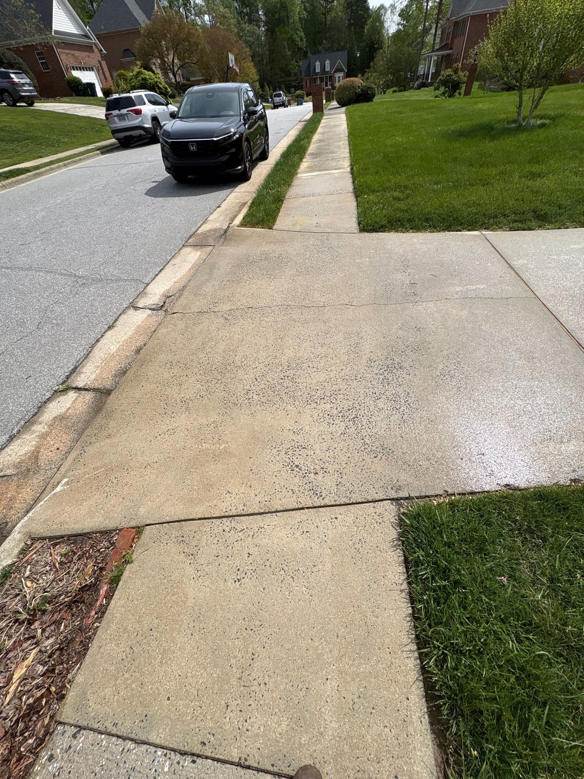 Driveway pressure washing and cleaning of concrete surfaces