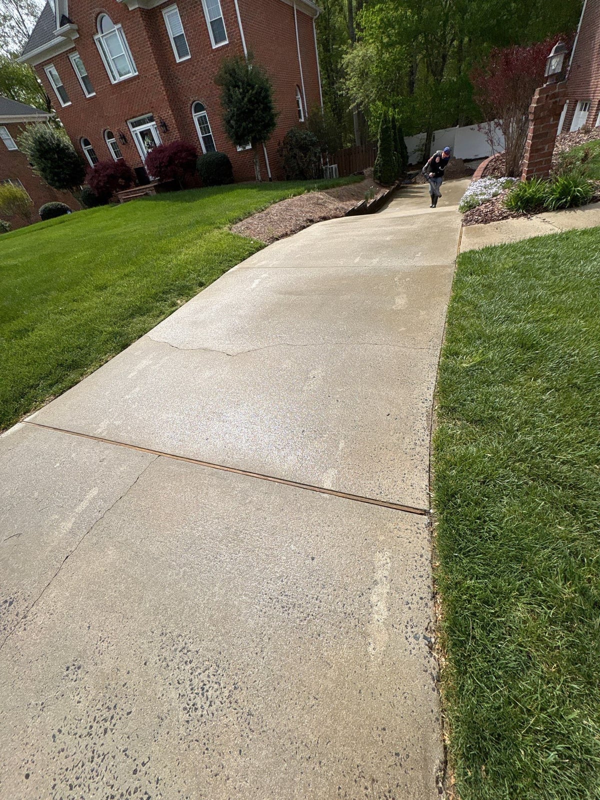 Driveway pressure washing and cleaning of concrete surfaces