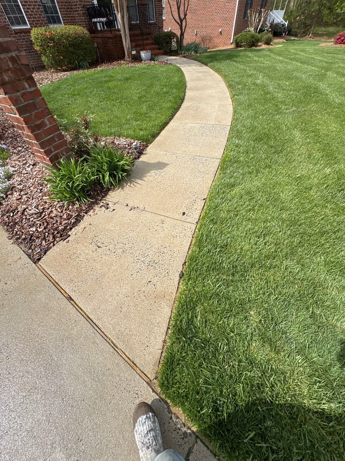 Driveway pressure washing and cleaning of concrete surfaces