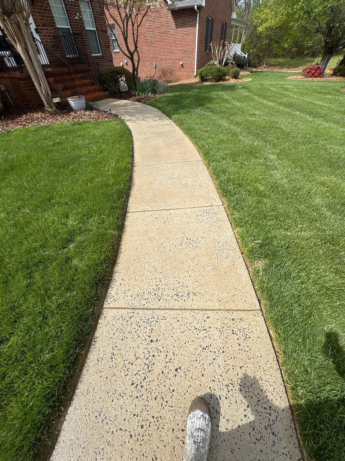 Driveway pressure washing and cleaning of concrete surfaces
