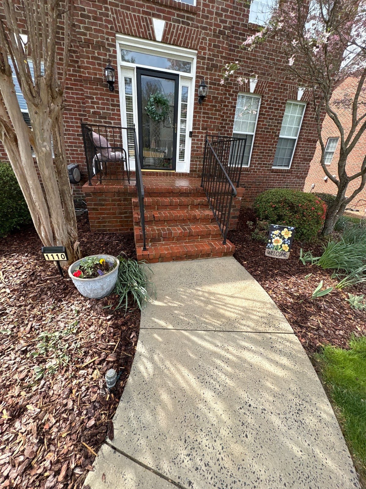 Driveway pressure washing and cleaning of concrete surfaces