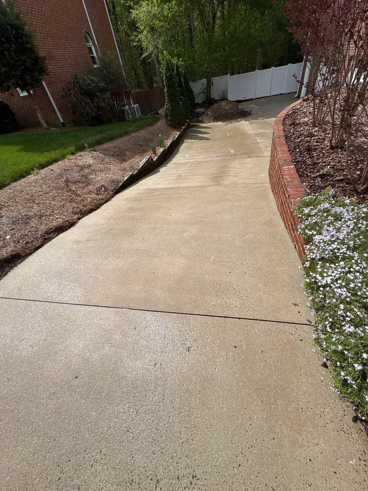 Driveway pressure washing and cleaning of concrete surfaces