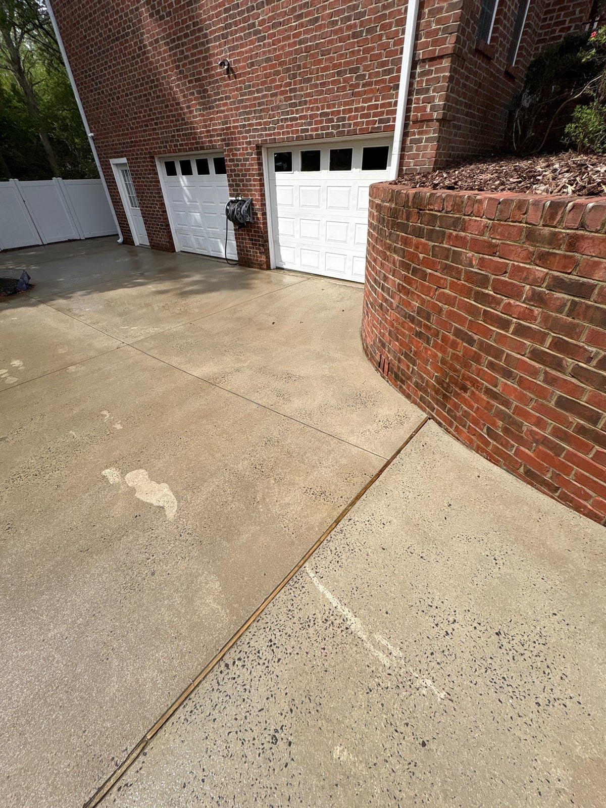 Driveway pressure washing and cleaning of concrete surfaces