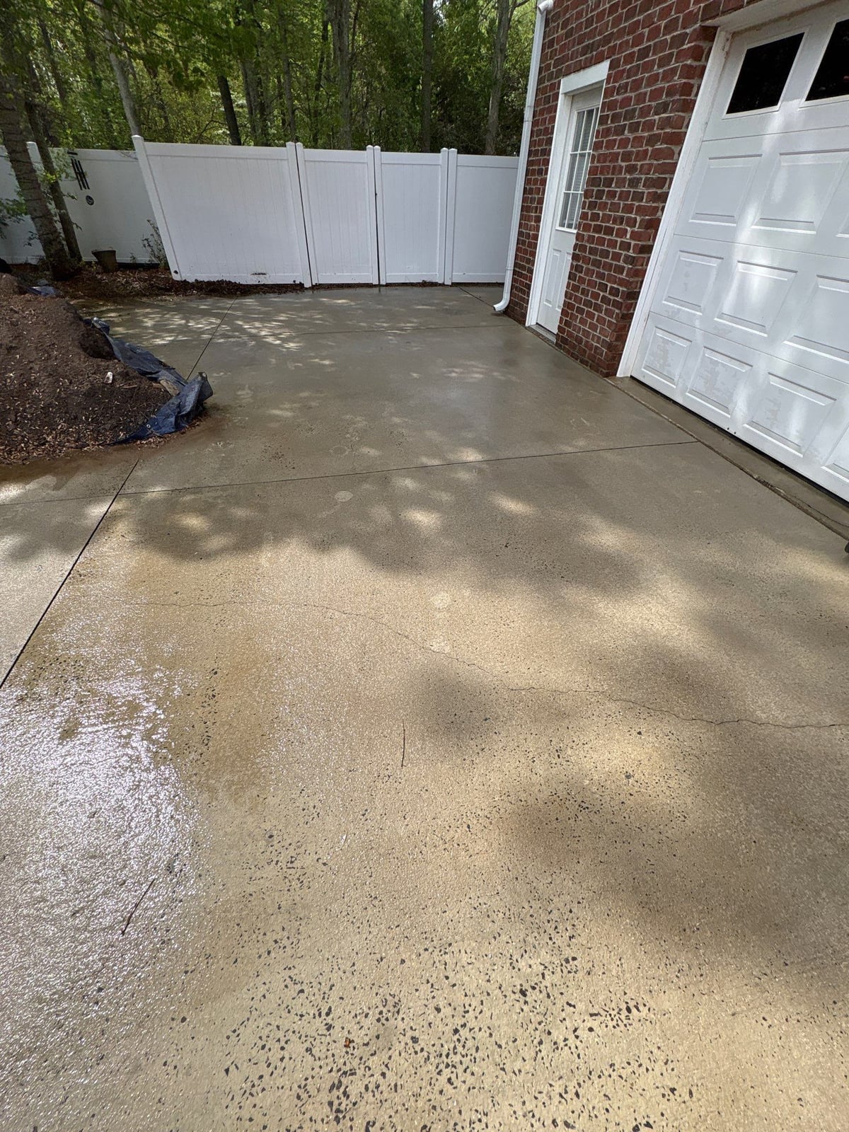 Driveway pressure washing and cleaning of concrete surfaces
