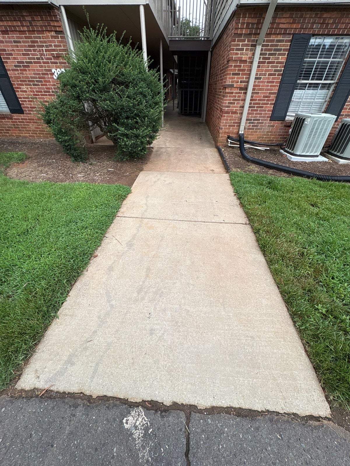 Concrete walkway power washing and exterior surface cleaning