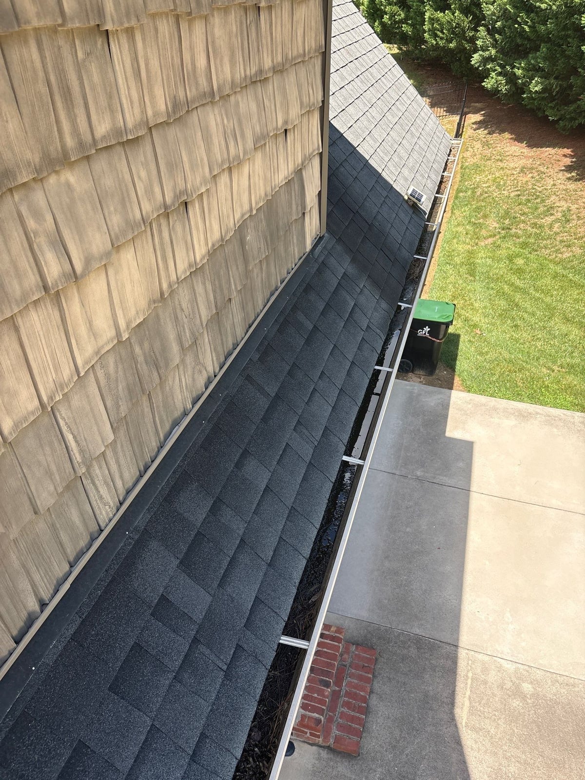 Residential roof gutter cleaning and debris removal