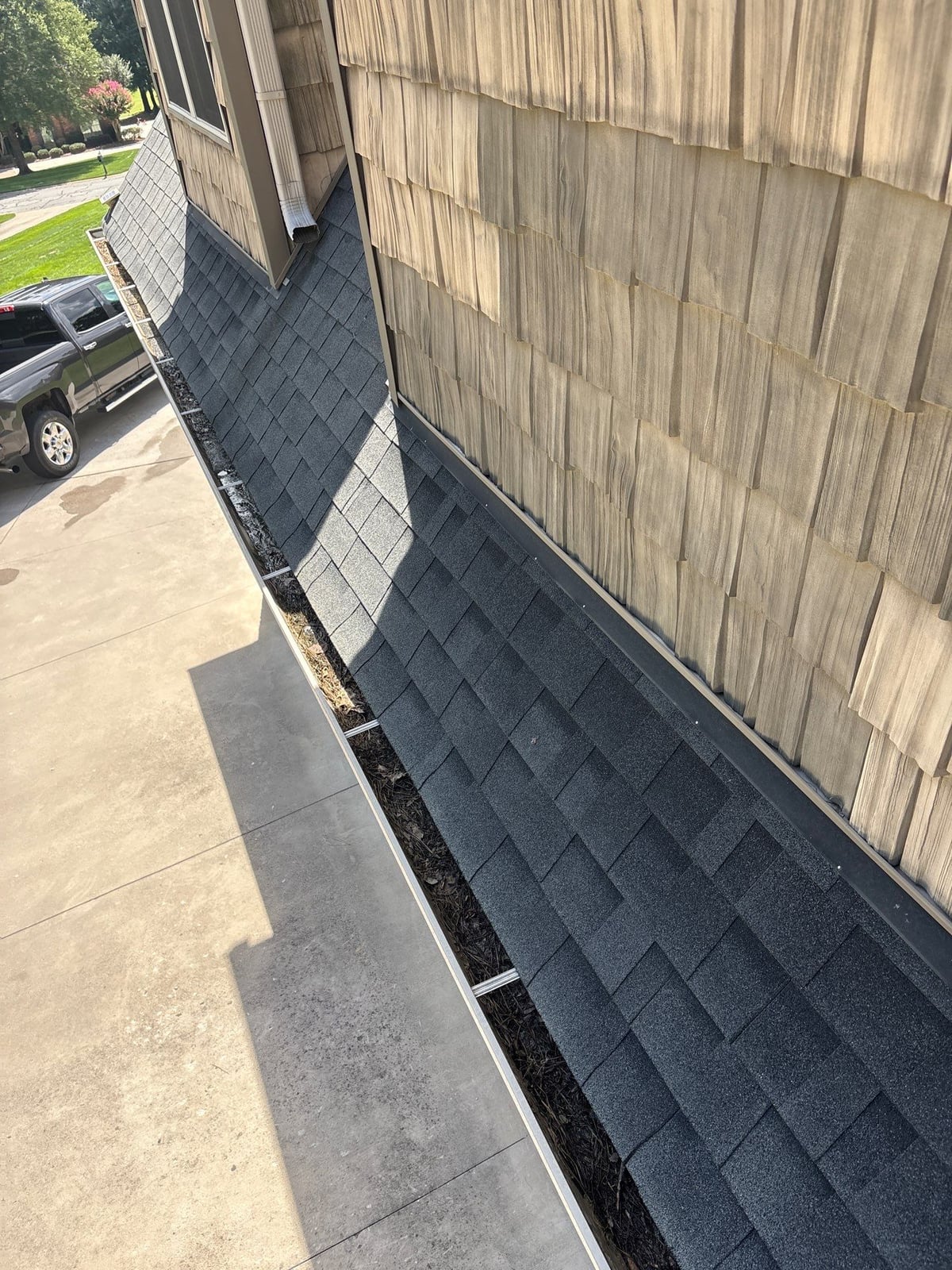 Residential roof gutter cleaning and debris removal