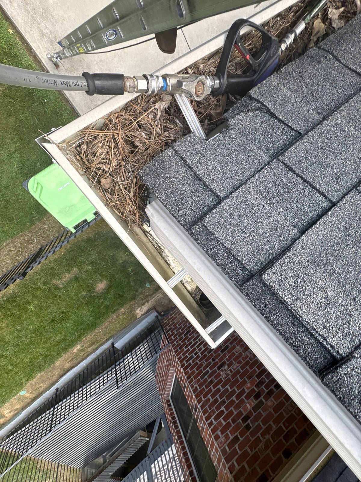 Residential roof gutter cleaning and debris removal