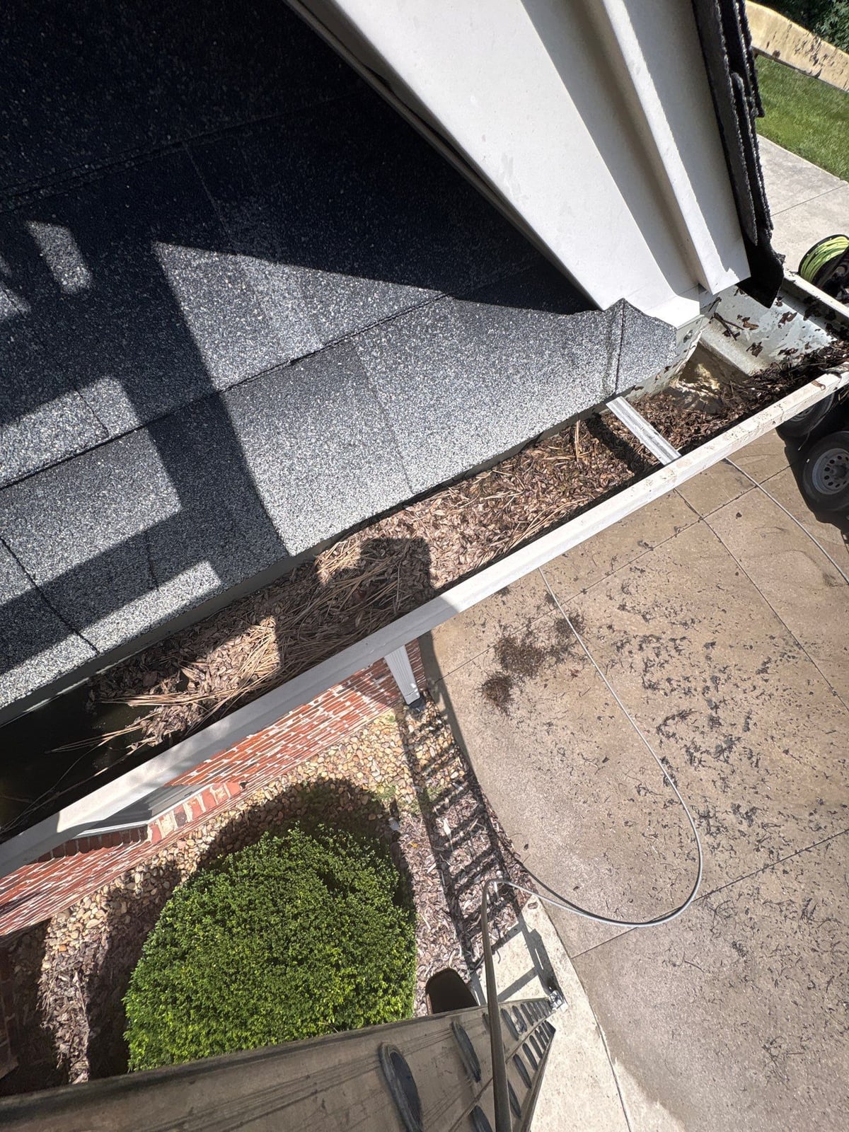 Residential roof gutter cleaning and debris removal