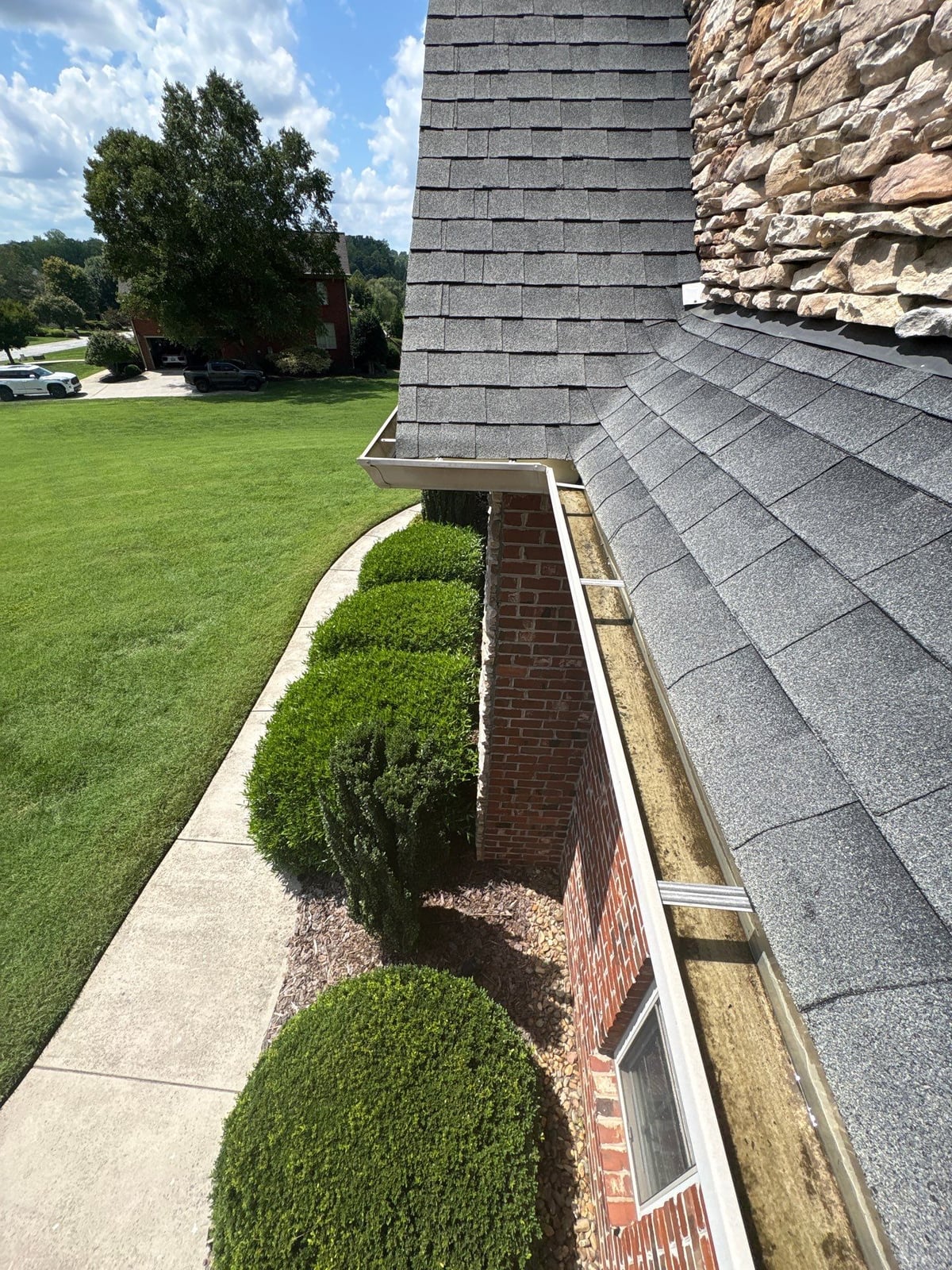 Residential roof gutter cleaning and debris removal