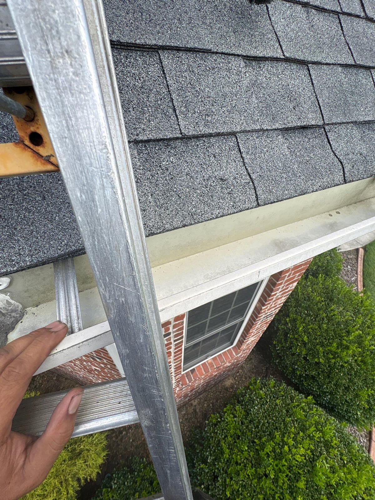 Residential roof gutter cleaning and debris removal
