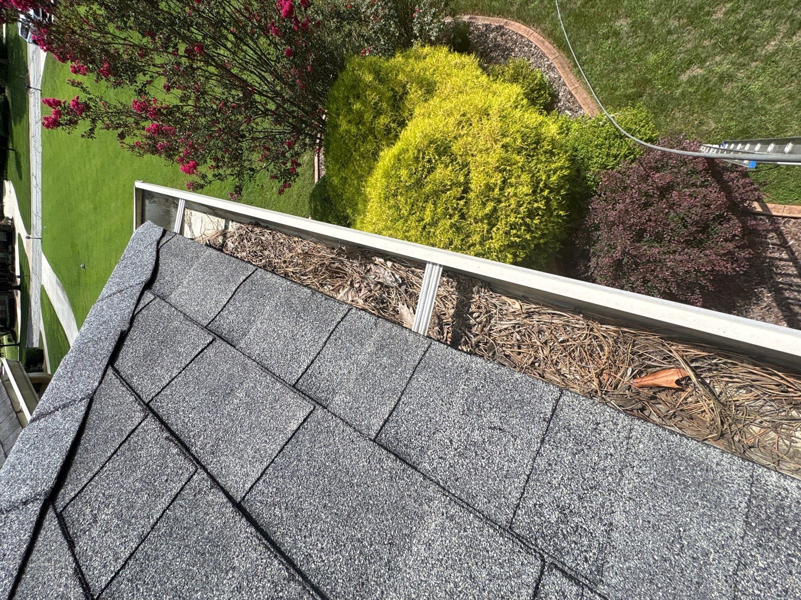 Residential roof gutter cleaning and debris removal