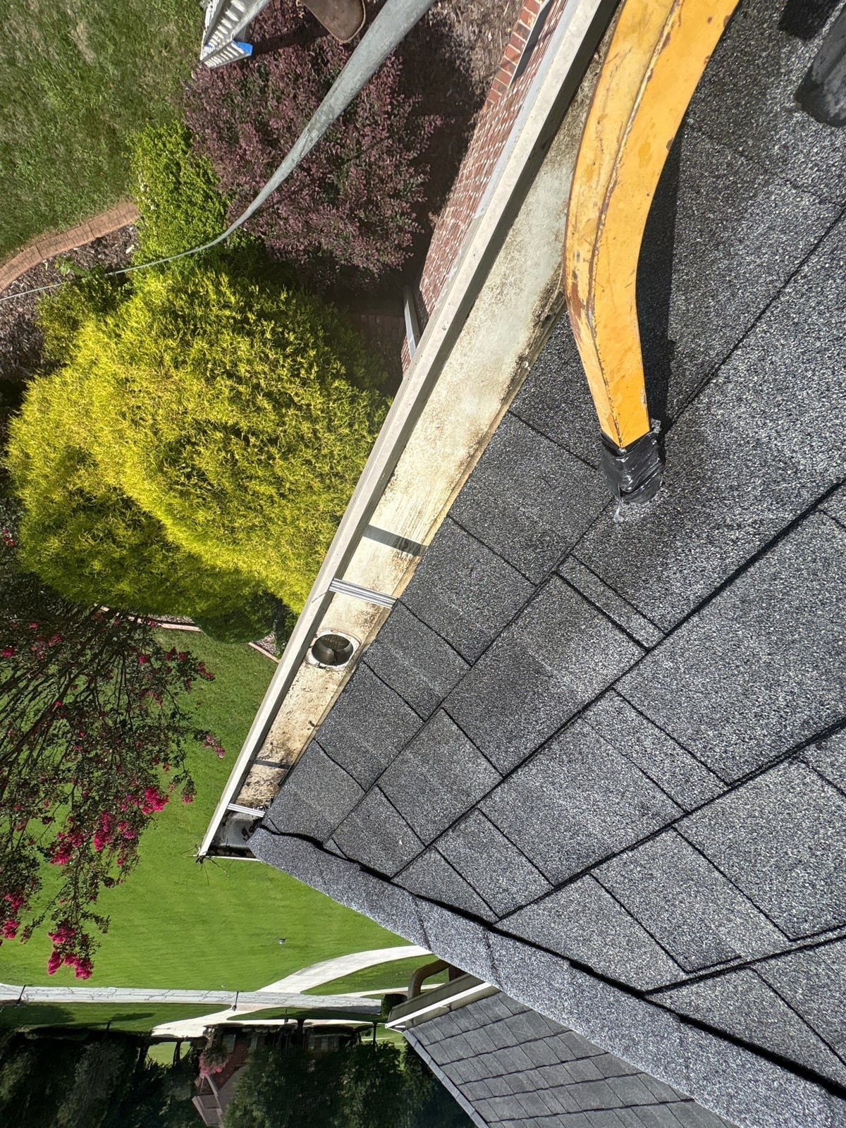 Residential roof gutter cleaning and debris removal