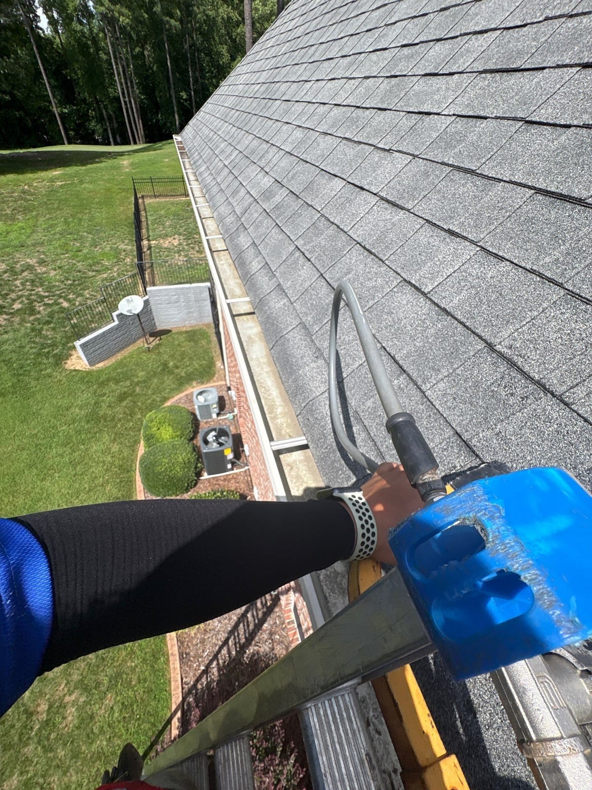 Residential roof gutter cleaning and debris removal