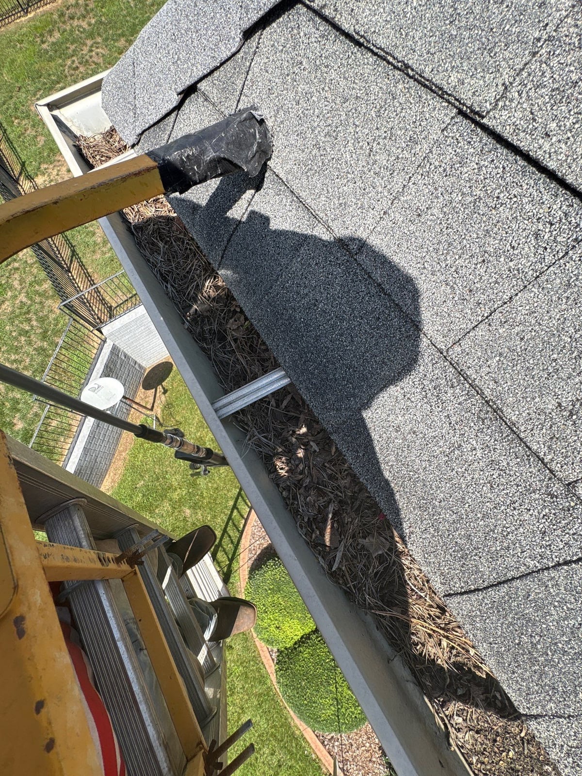 Residential roof gutter cleaning and debris removal
