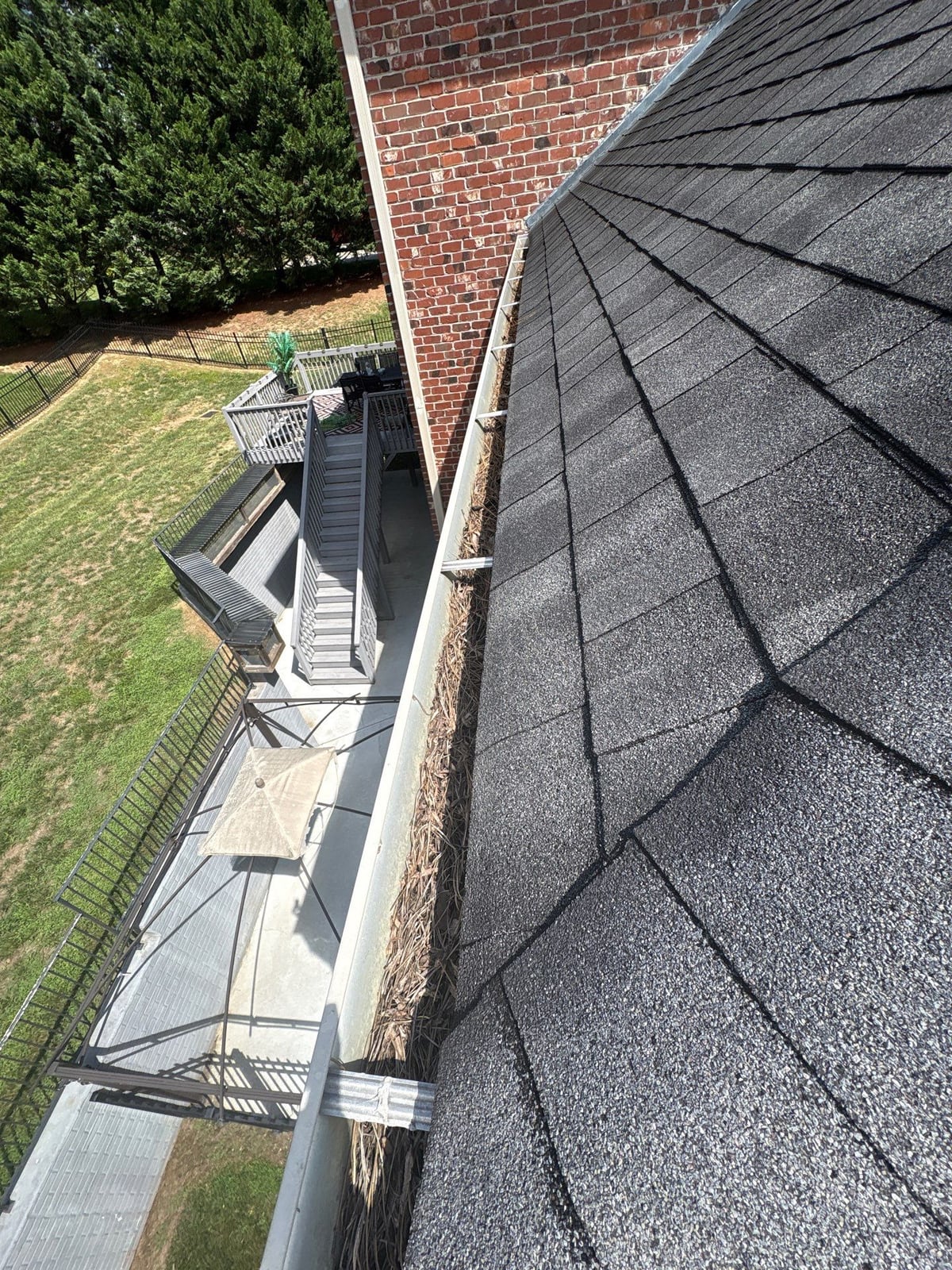 Residential roof gutter cleaning and debris removal