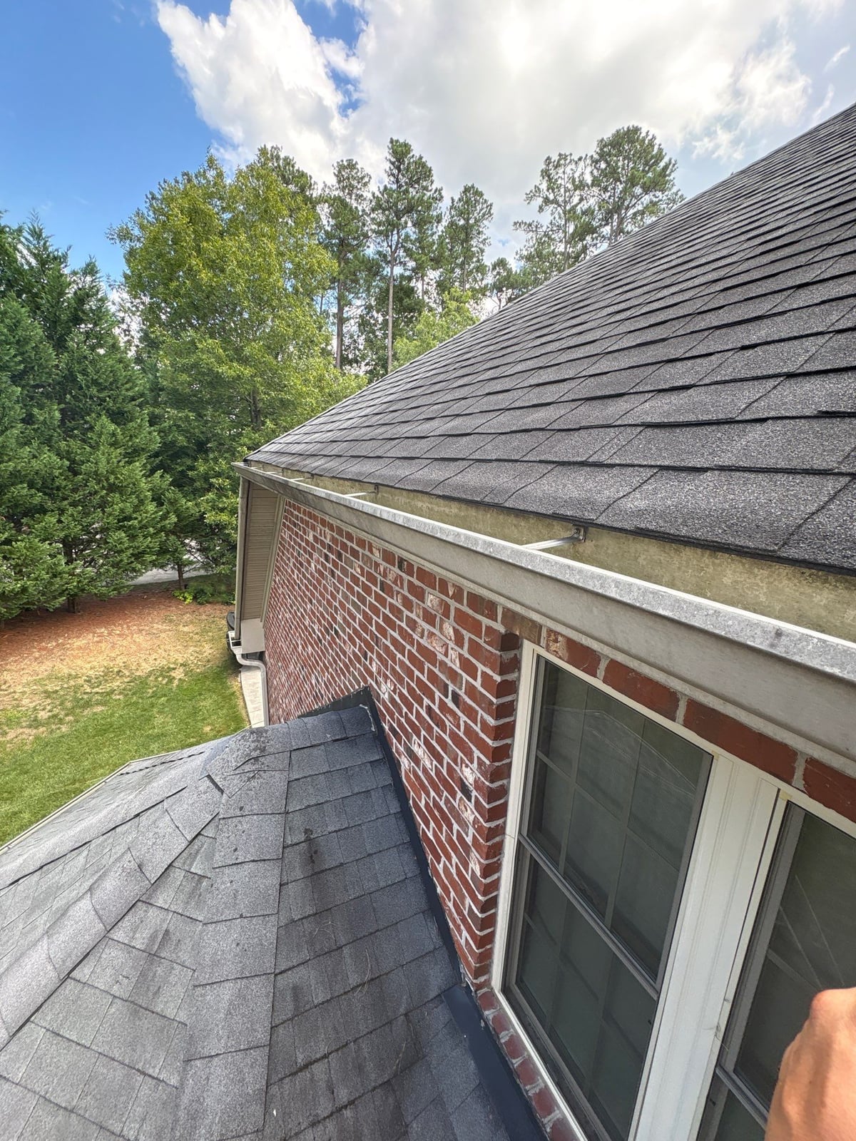 Residential roof gutter cleaning and debris removal