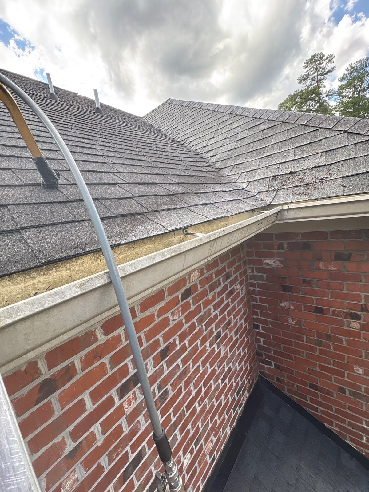 Residential roof gutter cleaning and debris removal