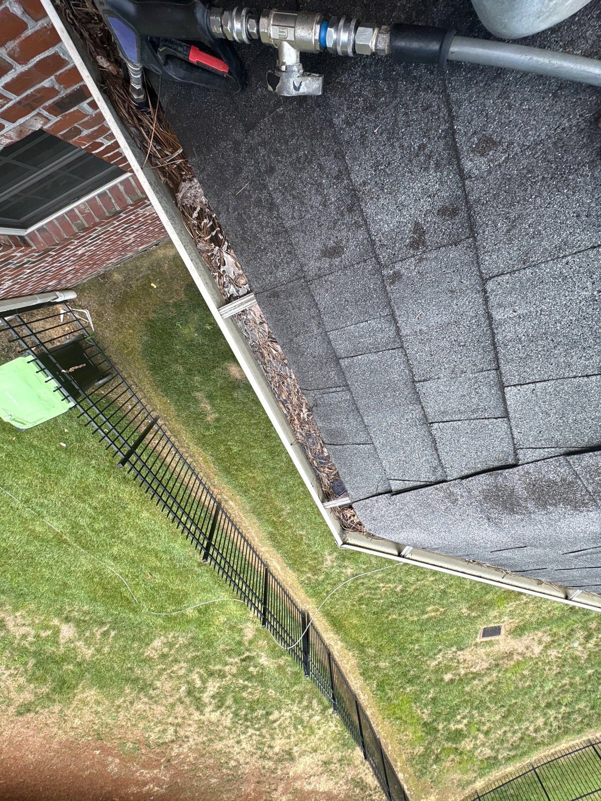 Residential roof gutter cleaning and debris removal