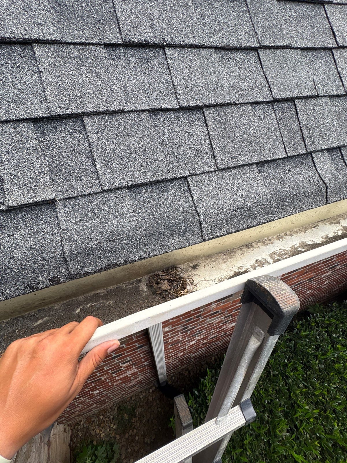 Residential roof gutter cleaning and debris removal