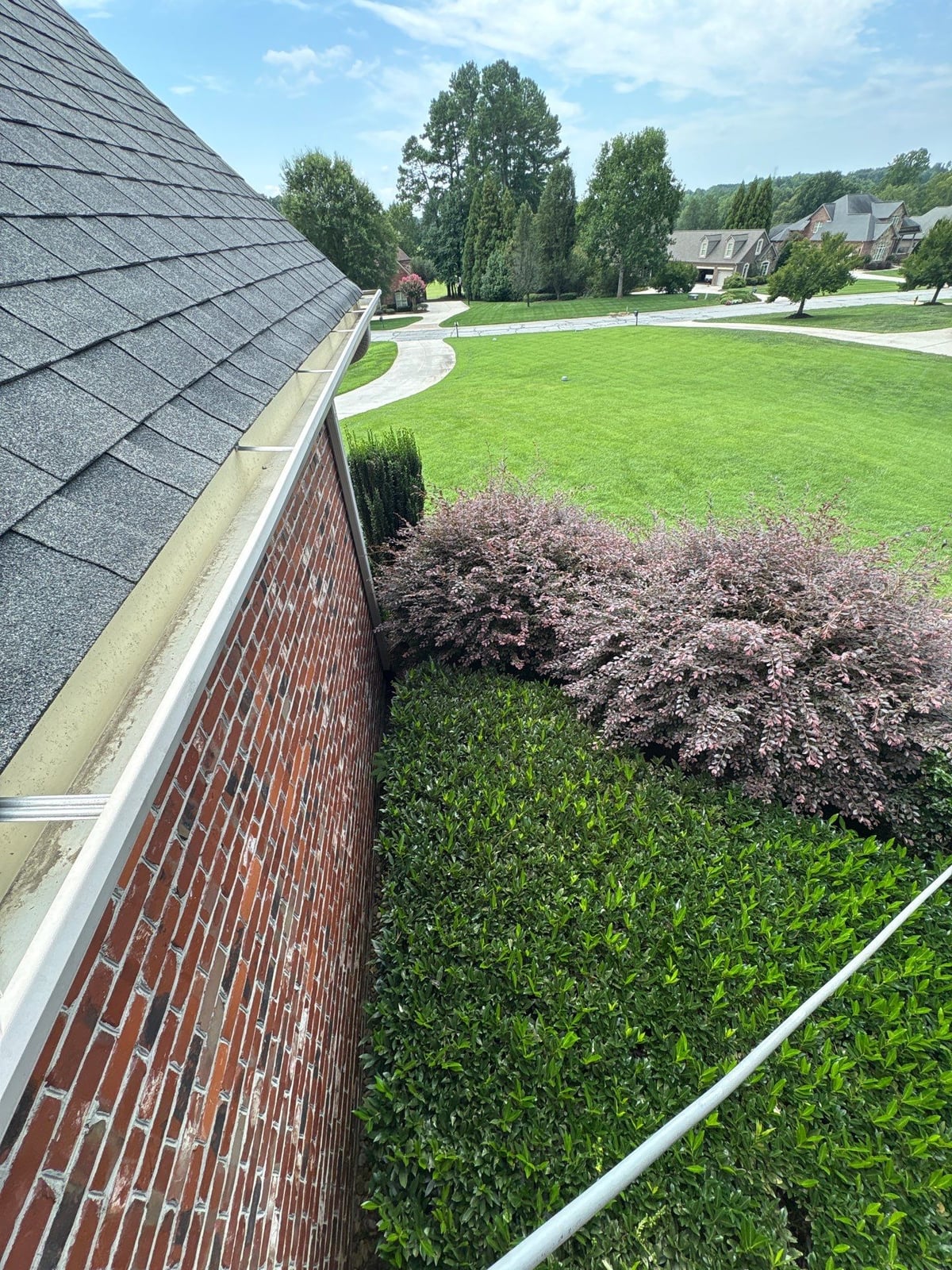 Residential roof gutter cleaning and debris removal