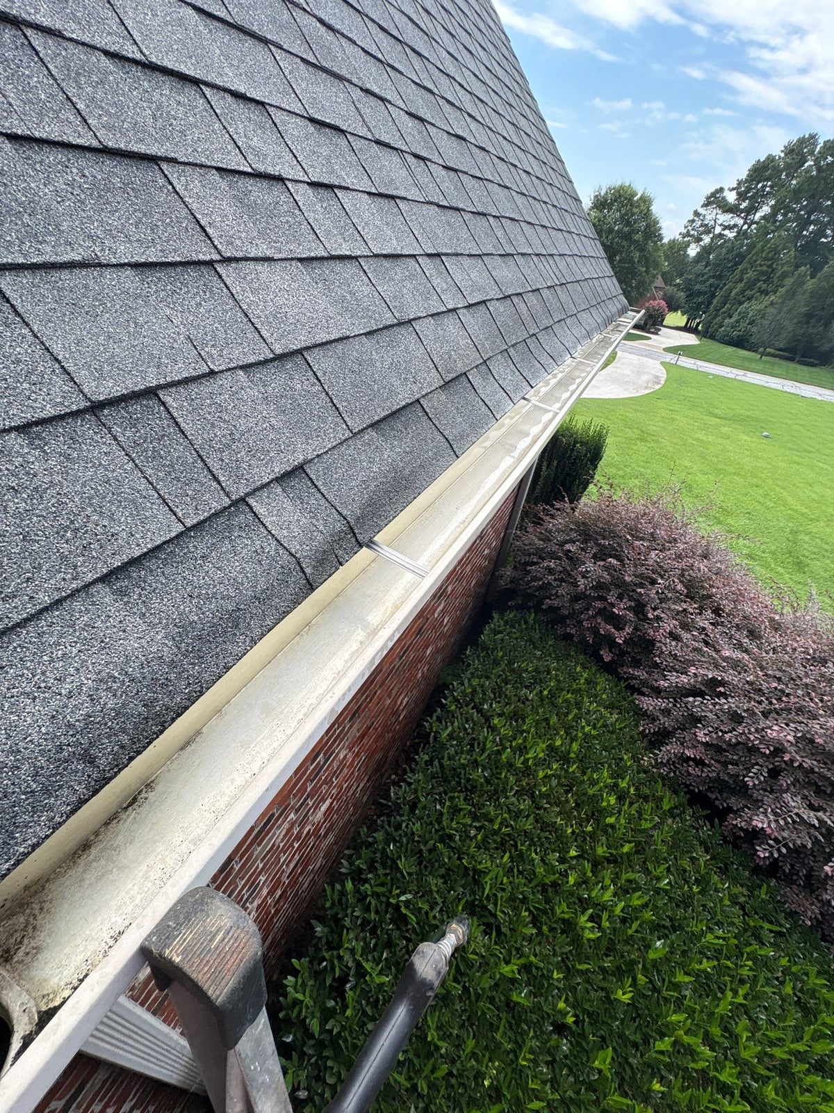 Residential roof gutter cleaning and debris removal