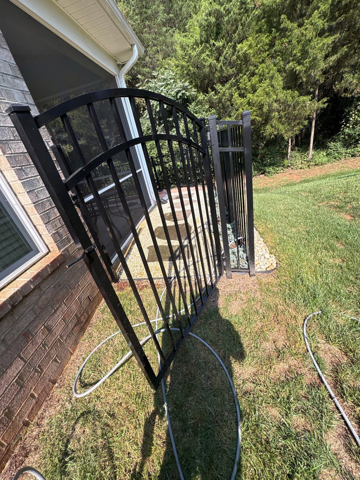 Sun porch fence and patio washing with gutter cleaning