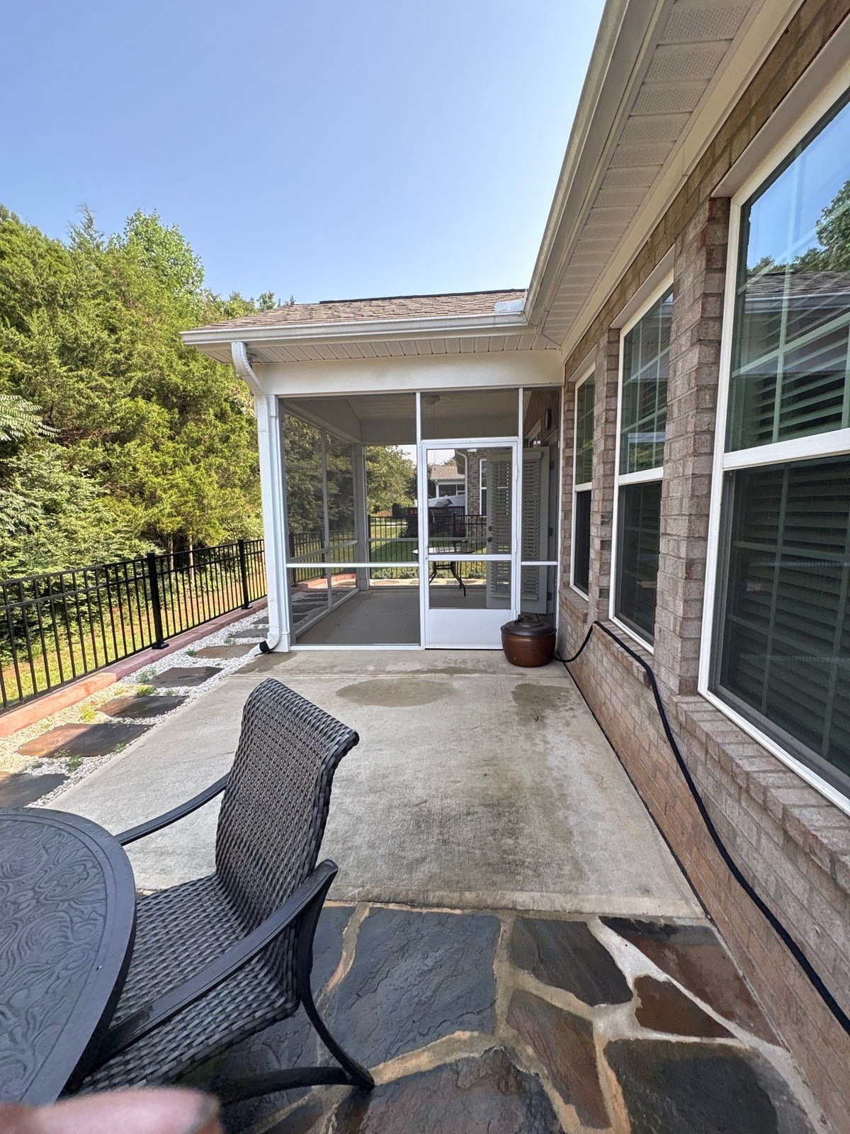 Sun porch fence and patio washing with gutter cleaning