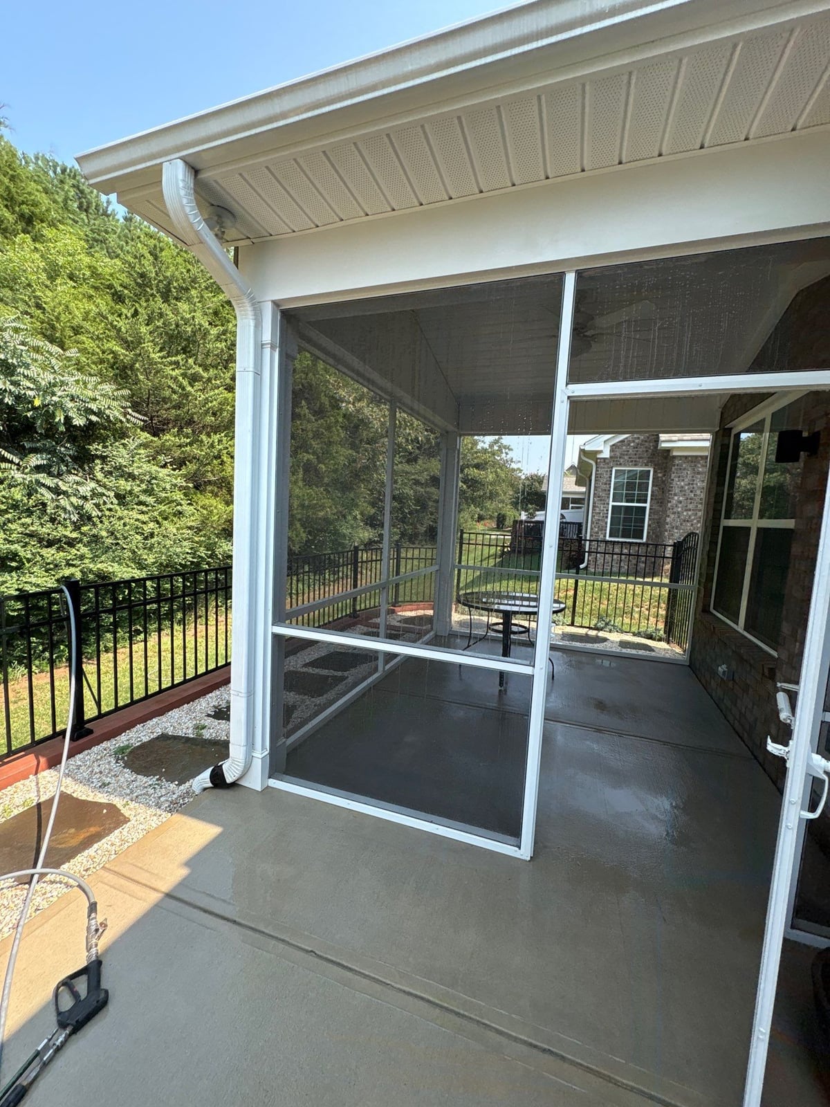 Sun porch fence and patio washing with gutter cleaning