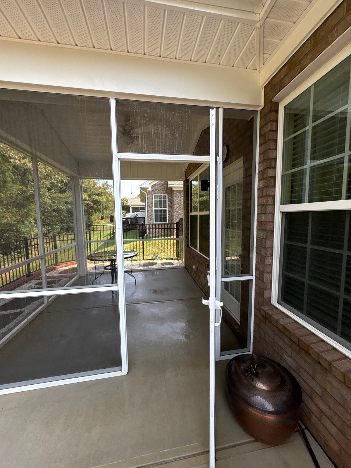 Sun porch fence and patio washing with gutter cleaning