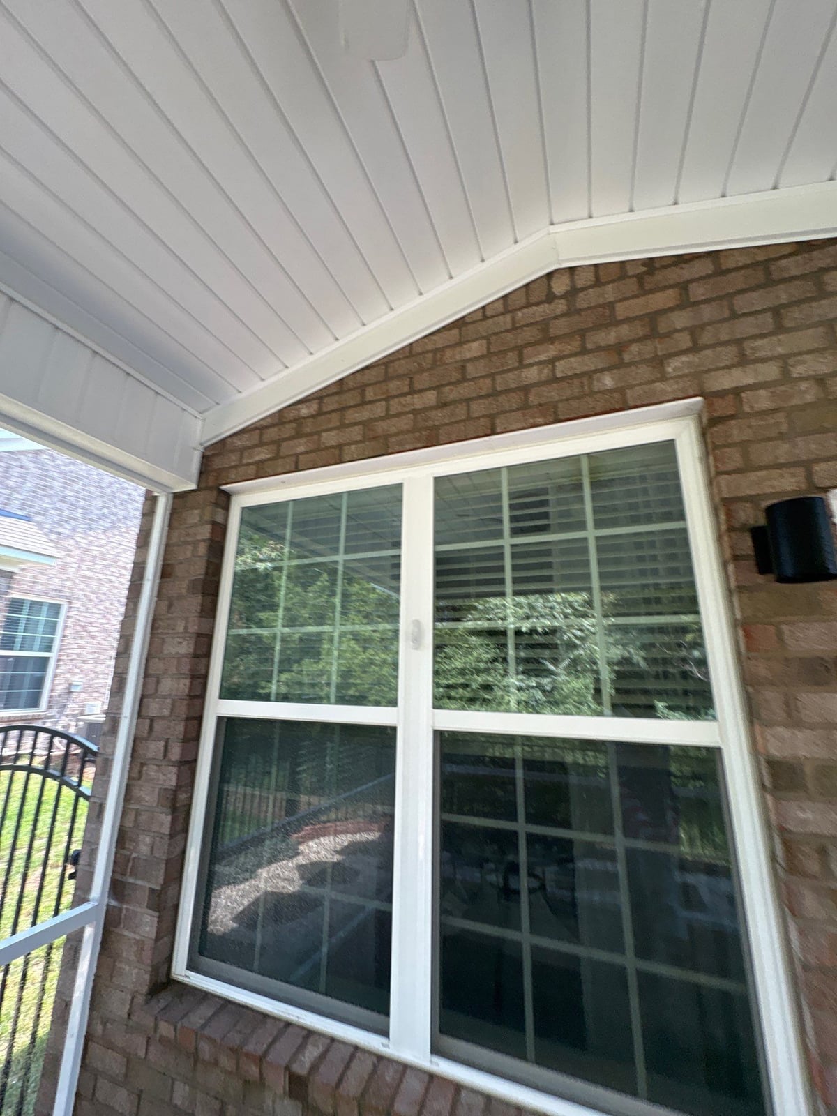 Sun porch fence and patio washing with gutter cleaning