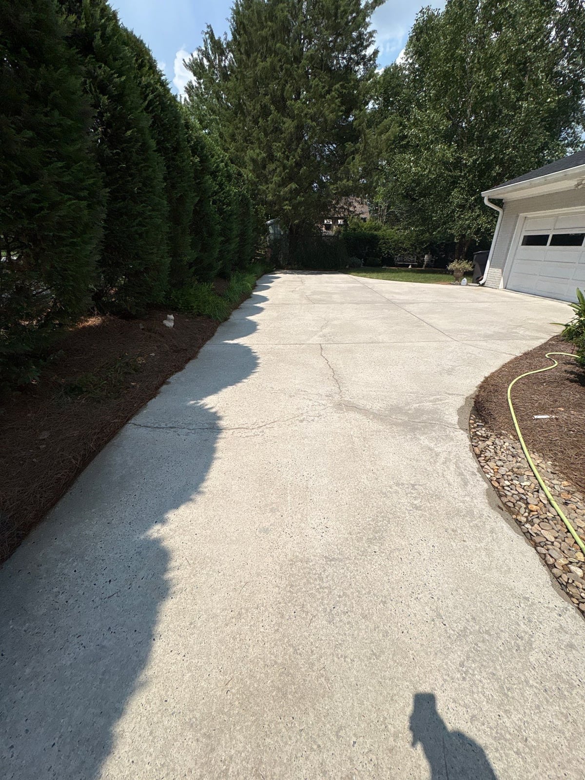 Pressure washing and surface cleaning of residential driveway
