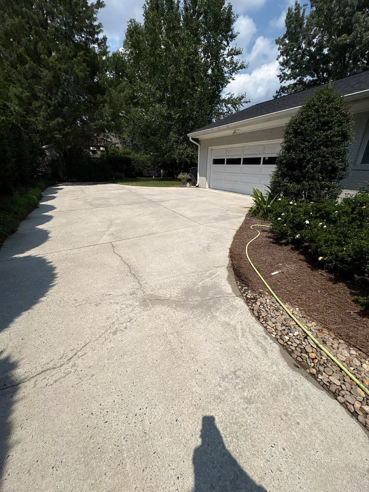 Pressure washing and surface cleaning of residential driveway