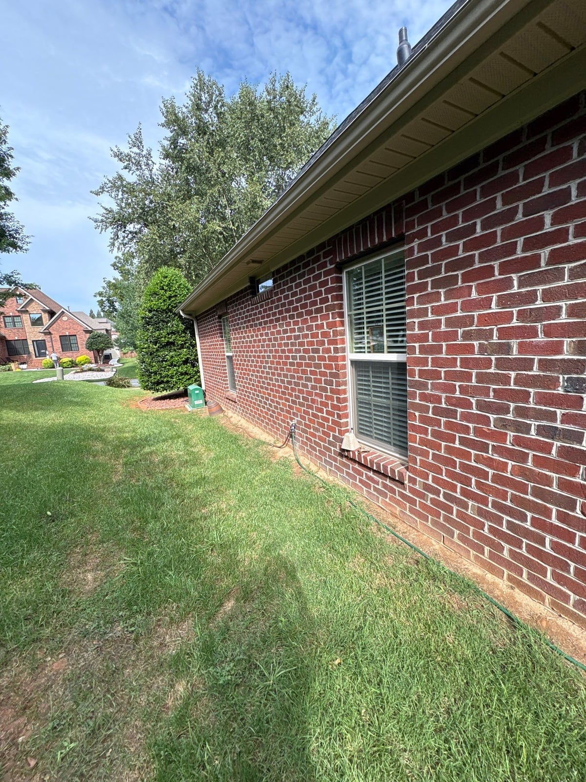 Brick patio pavers installation with front walkway and washing