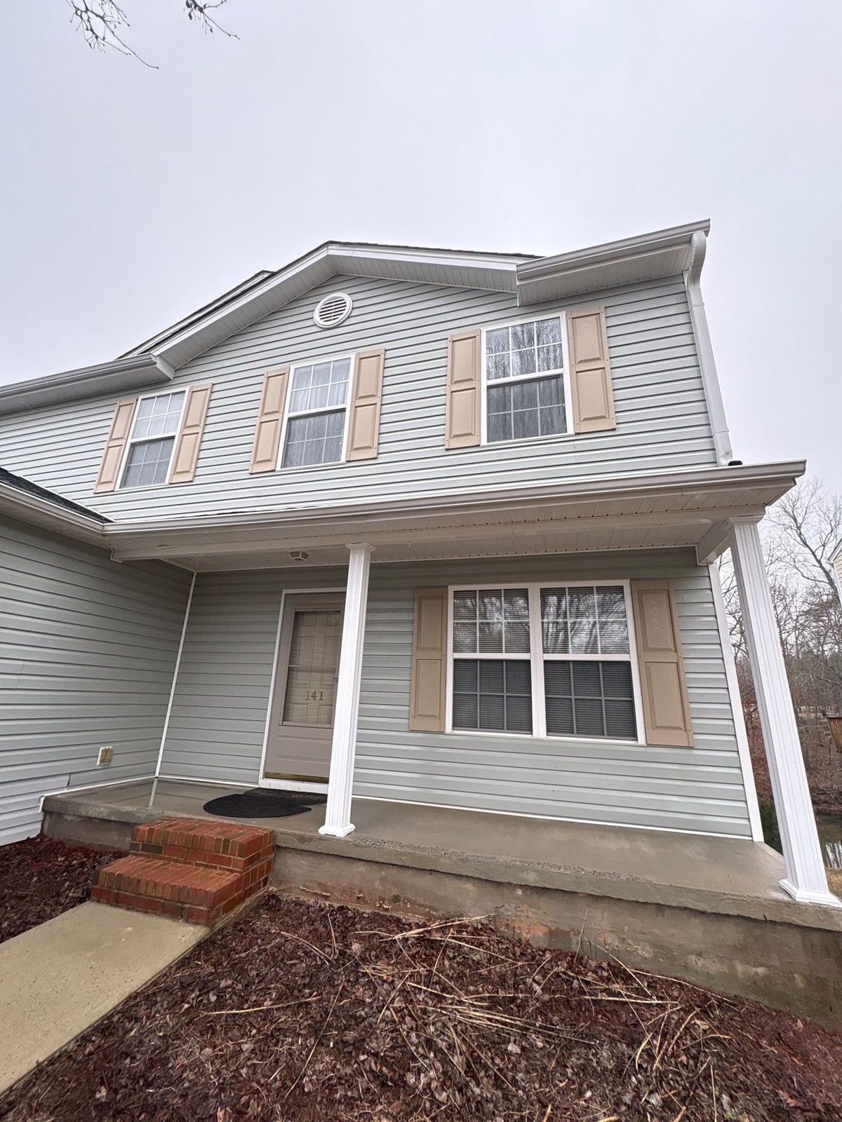 Exterior house washing and concrete driveway pressure cleaning