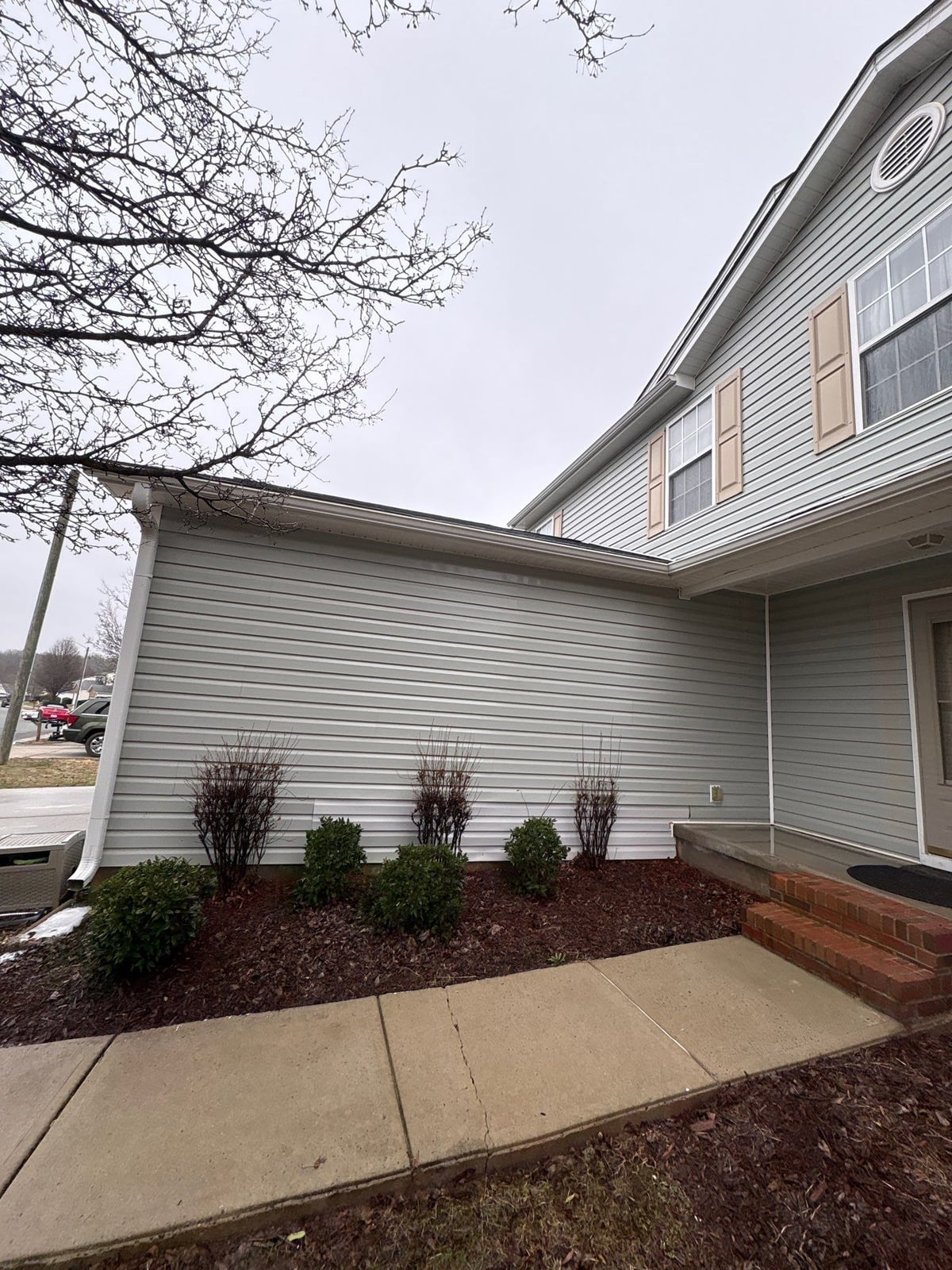 Exterior house washing and concrete driveway pressure cleaning