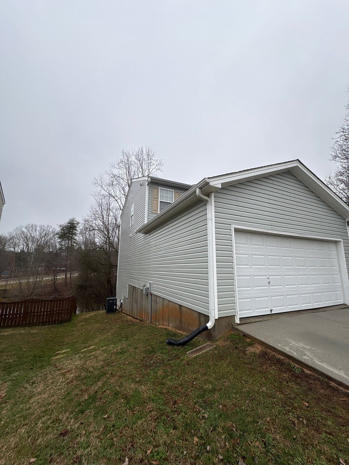 Exterior house washing and concrete driveway pressure cleaning