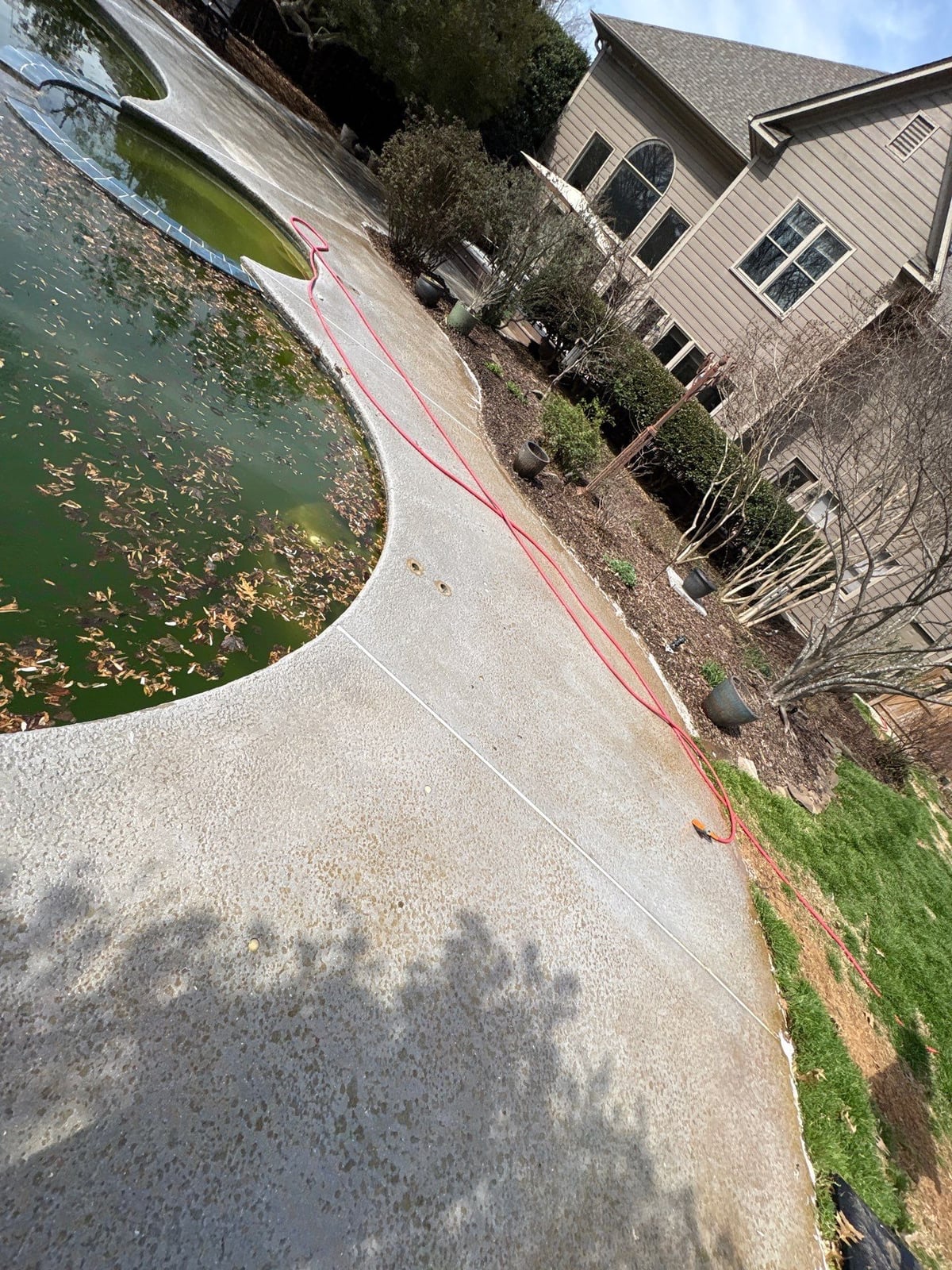 Soft washing and cleaning of residential pool deck surface