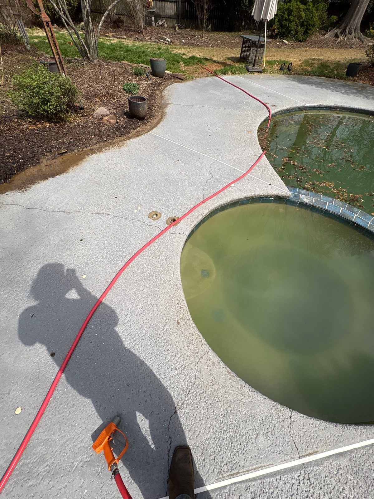 Soft washing and cleaning of residential pool deck surface