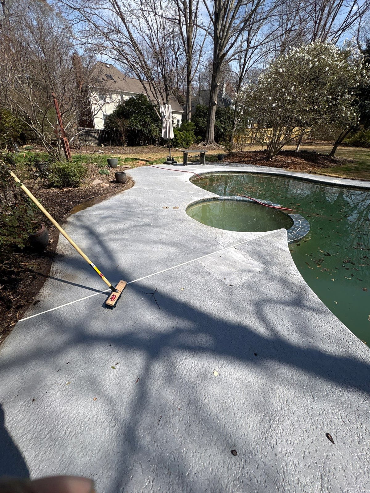 Soft washing and cleaning of residential pool deck surface